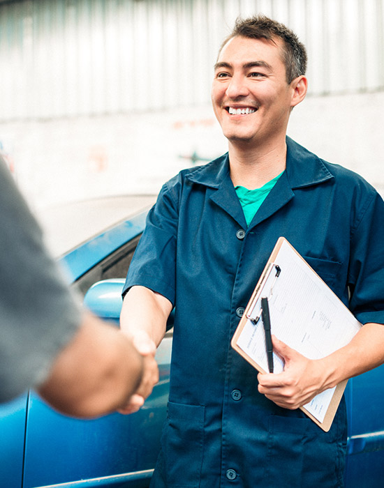mechanic shaking hands with client
